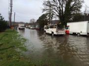 Flooded road with emergency vehicles